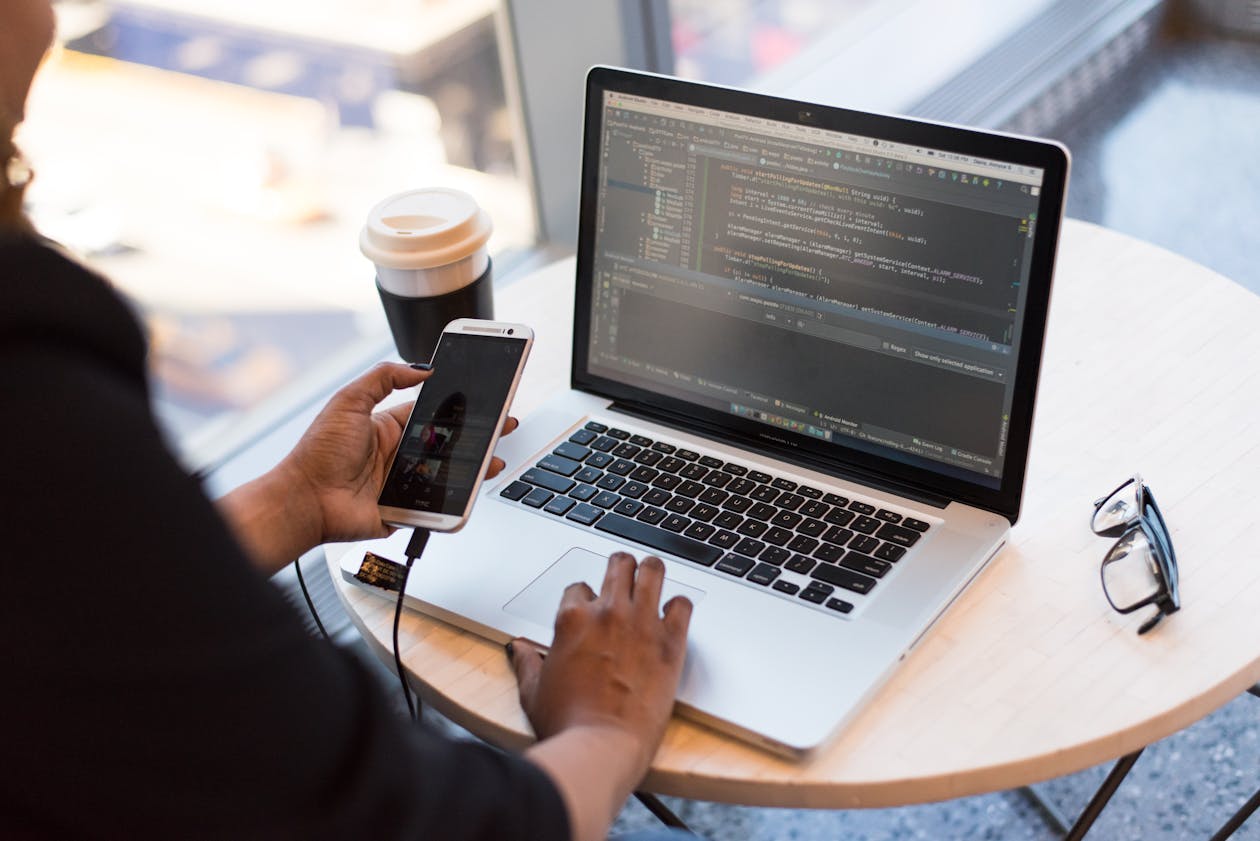 Mobile app developer coding