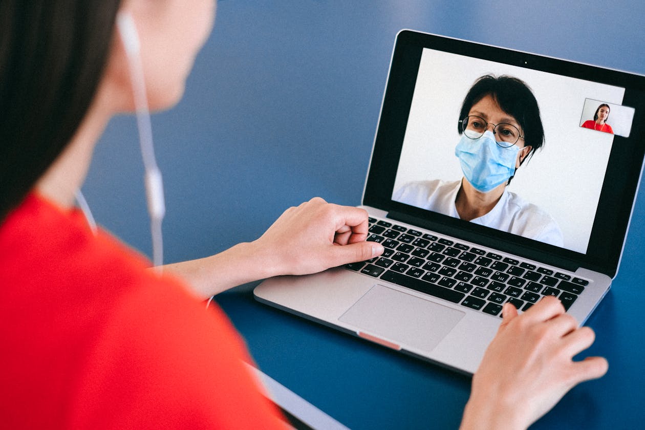 Doctor using medical app on tablet for telemedicine